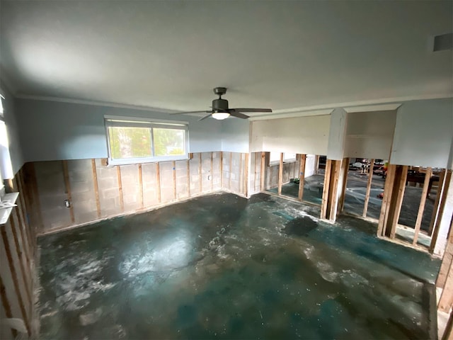 13931 King Ave, Hudson, FL 34667 - unfurnished room featuring ornamental molding, a ceiling fan, and concrete floors