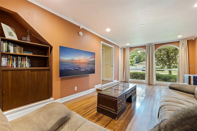 10053 W Bay St, Seminole, FL 33776 - living area featuring wood-type flooring, ornamental molding, and recessed lighting