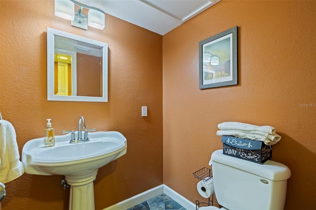 10053 W Bay St, Seminole, FL 33776 - bathroom with toilet and baseboards