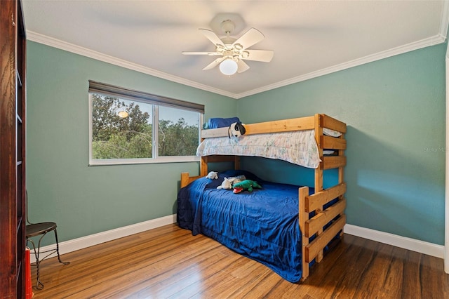 10053 W Bay St, Seminole, FL 33776 - bedroom with wood finished floors, crown molding, and a ceiling fan