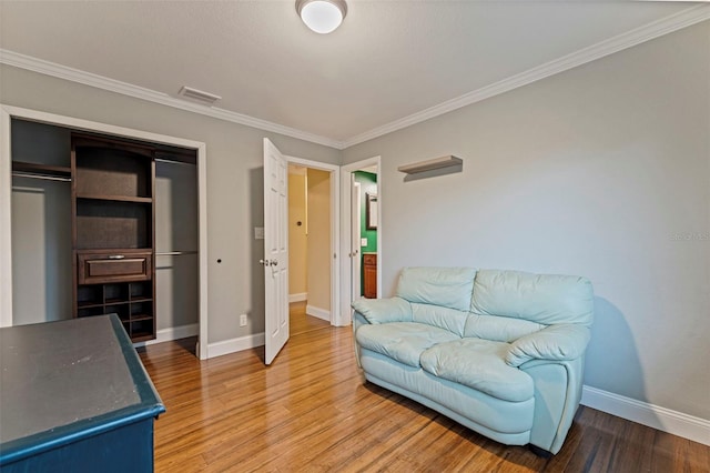 10053 W Bay St, Seminole, FL 33776 - living area featuring light wood-style floors and ornamental molding