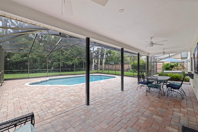 10053 W Bay St, Seminole, FL 33776 - view of swimming pool with ceiling fan, a patio area, and glass enclosure