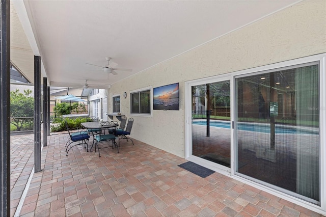 10053 W Bay St, Seminole, FL 33776 - view of patio / terrace with a ceiling fan and outdoor dining space