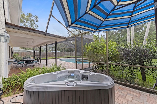 10053 W Bay St, Seminole, FL 33776 - view of patio / terrace featuring a hot tub, a ceiling fan, and outdoor dining area
