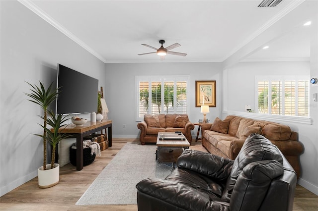 1631 Shady Oaks Dr, Oldsmar, FL 34677 - living area with plenty of natural light, ceiling fan, light wood-style floors, crown molding, and recessed lighting