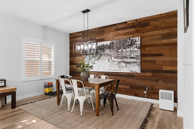 1631 Shady Oaks Dr, Oldsmar, FL 34677 - dining room with wood walls, wood finished floors, and a chandelier