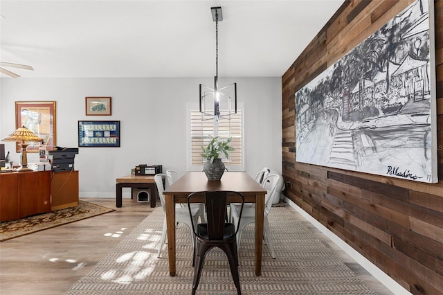 1631 Shady Oaks Dr, Oldsmar, FL 34677 - dining space with wooden walls, light wood finished floors, plenty of natural light, and ceiling fan