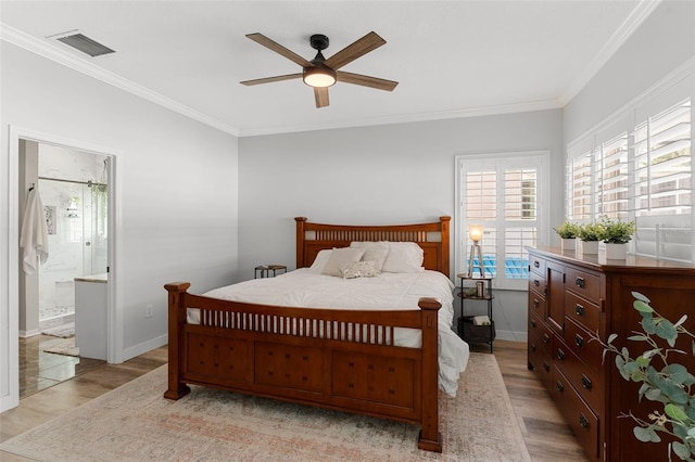 1631 Shady Oaks Dr, Oldsmar, FL 34677 - bedroom featuring light wood-style floors, ornamental molding, ceiling fan, and connected bathroom