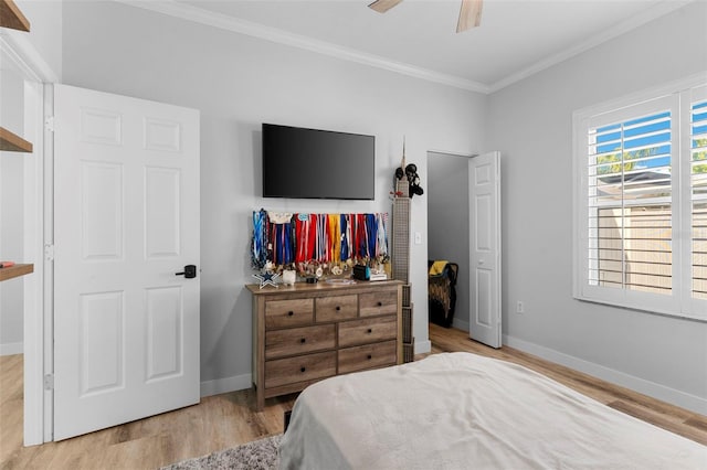 1631 Shady Oaks Dr, Oldsmar, FL 34677 - bedroom with light wood-type flooring, ornamental molding, and a ceiling fan