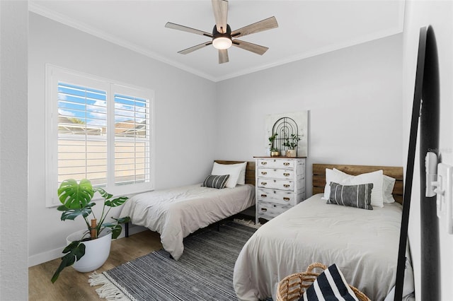 1631 Shady Oaks Dr, Oldsmar, FL 34677 - bedroom with wood finished floors, crown molding, and ceiling fan