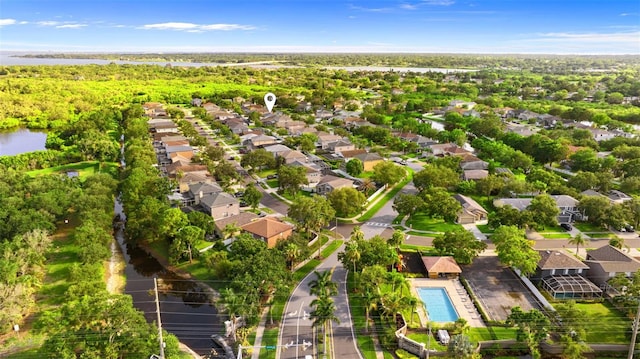1631 Shady Oaks Dr, Oldsmar, FL 34677 - aerial perspective of suburban area with a pool and a large body of water
