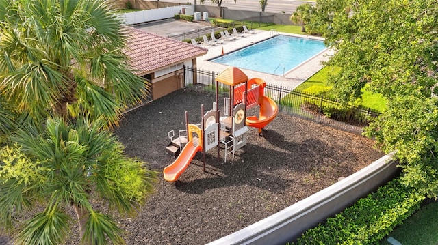 1631 Shady Oaks Dr, Oldsmar, FL 34677 - community pool with a fenced backyard and a patio area