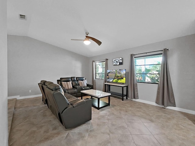 852 Village Way, Palm Harbor, FL 34683 - living area featuring vaulted ceiling, a ceiling fan, and light tile patterned floors