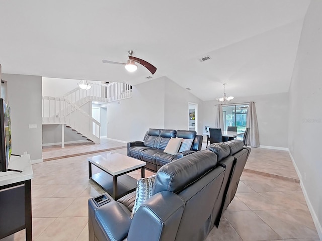 852 Village Way, Palm Harbor, FL 34683 - living room featuring light tile patterned floors, a chandelier, stairway, a ceiling fan, and lofted ceiling