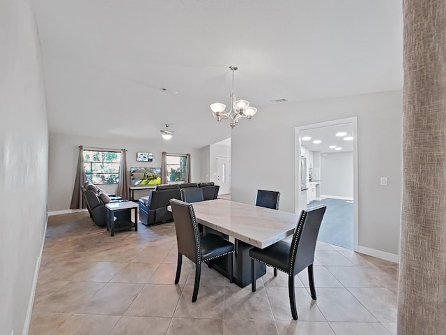852 Village Way, Palm Harbor, FL 34683 - dining area with a chandelier and light tile patterned floors