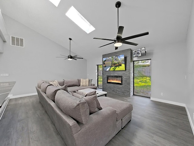 852 Village Way, Palm Harbor, FL 34683 - living area with a ceiling fan, a fireplace, a skylight, wood finished floors, and high vaulted ceiling