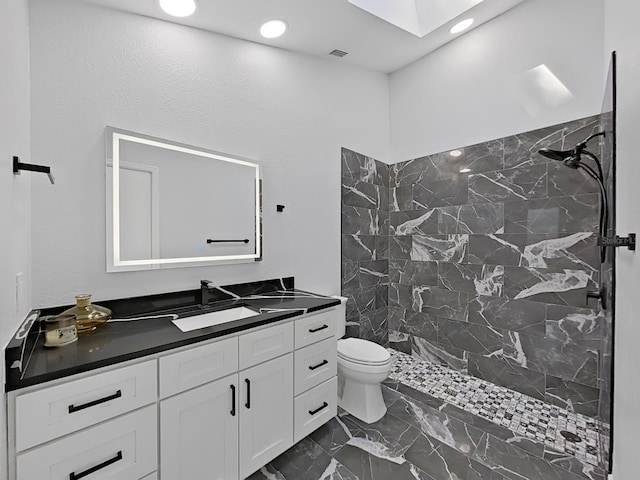 852 Village Way, Palm Harbor, FL 34683 - full bathroom with marble finish floors, vanity, a marble finish shower, recessed lighting, and a skylight