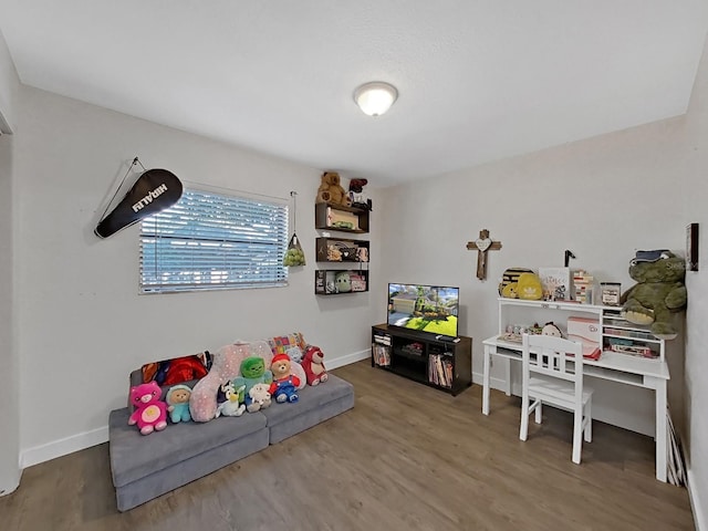 852 Village Way, Palm Harbor, FL 34683 - game room with wood finished floors and baseboards