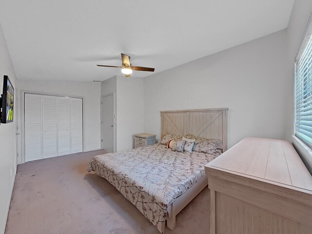 852 Village Way, Palm Harbor, FL 34683 - carpeted bedroom with a ceiling fan and a closet