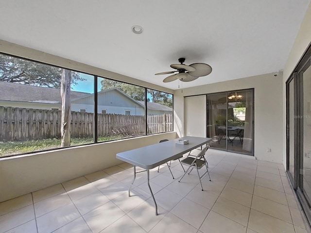 852 Village Way, Palm Harbor, FL 34683 - sunroom with ceiling fan, outdoor dining area, and tile patterned flooring