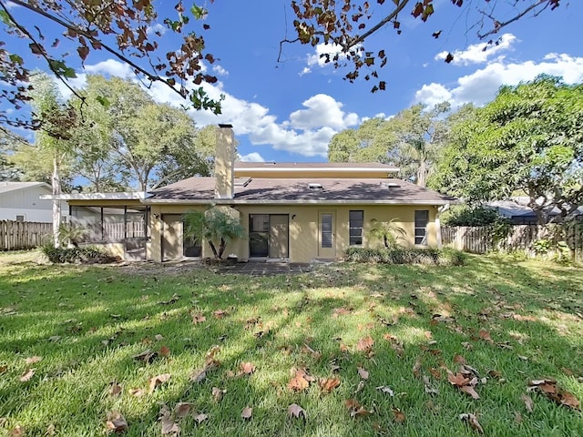 852 Village Way, Palm Harbor, FL 34683 - rear view of property featuring a chimney and a sunroom