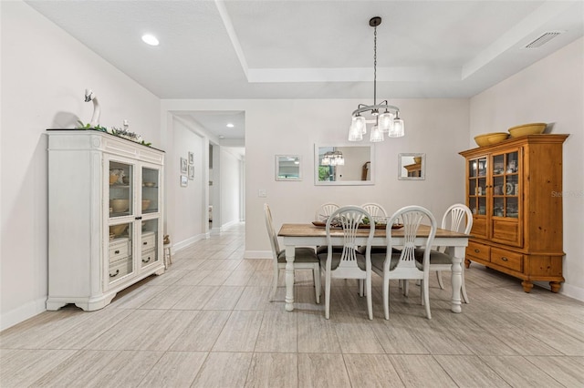 1237 Windy Bay Shl, Tarpon Springs, FL 34689 - dining area with a tray ceiling, a chandelier, and recessed lighting
