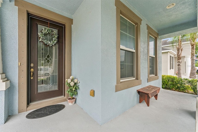 1237 Windy Bay Shl, Tarpon Springs, FL 34689 - property entrance featuring stucco siding and covered porch