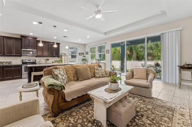 1237 Windy Bay Shl, Tarpon Springs, FL 34689 - living area with ceiling fan, a textured ceiling, light tile patterned floors, and recessed lighting