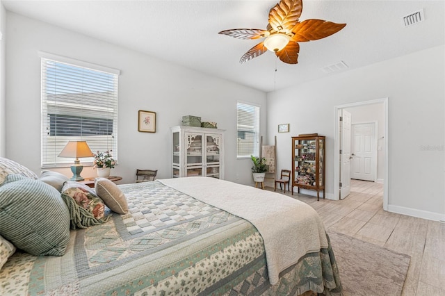 1237 Windy Bay Shl, Tarpon Springs, FL 34689 - bedroom with ceiling fan and light wood-style flooring