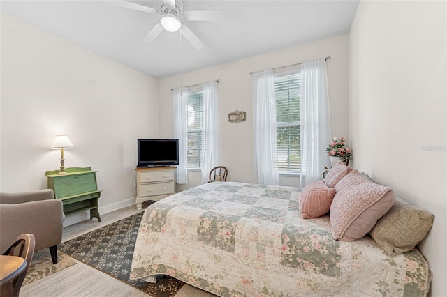 1237 Windy Bay Shl, Tarpon Springs, FL 34689 - bedroom featuring wood finished floors and a ceiling fan