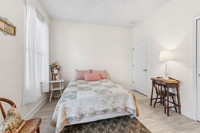 1237 Windy Bay Shl, Tarpon Springs, FL 34689 - bedroom featuring baseboards and a ceiling fan