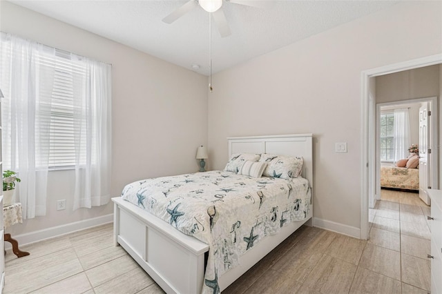 1237 Windy Bay Shl, Tarpon Springs, FL 34689 - bedroom featuring light tile patterned floors and ceiling fan