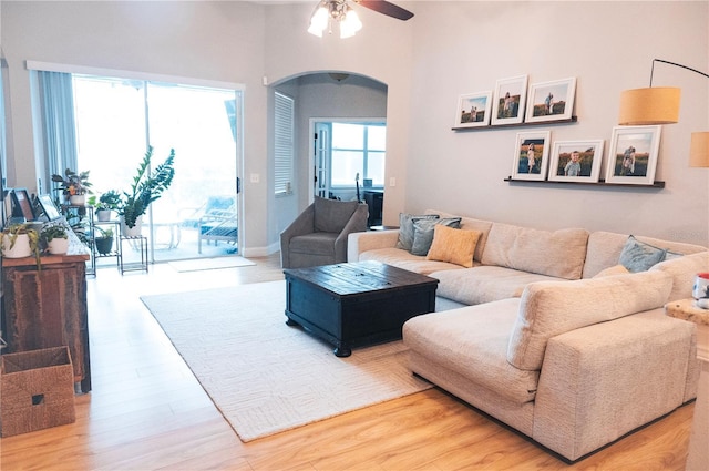 6804 Pleasant Oaks Pl, Riverview, FL 33578 - living room featuring arched walkways, a ceiling fan, and wood finished floors
