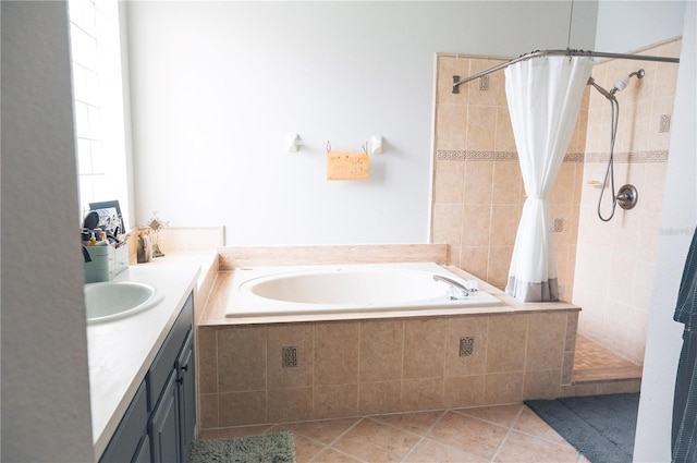 6804 Pleasant Oaks Pl, Riverview, FL 33578 - bathroom featuring a garden tub, a tile shower, tile patterned floors, and vanity