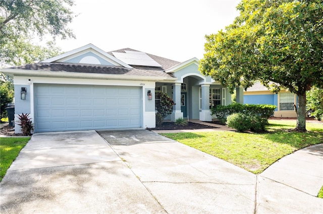 6804 Pleasant Oaks Pl, Riverview, FL 33578 - ranch-style house with stucco siding, driveway, and solar panels
