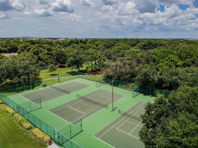 6804 Pleasant Oaks Pl, Riverview, FL 33578 - view of tennis court featuring a wooded view