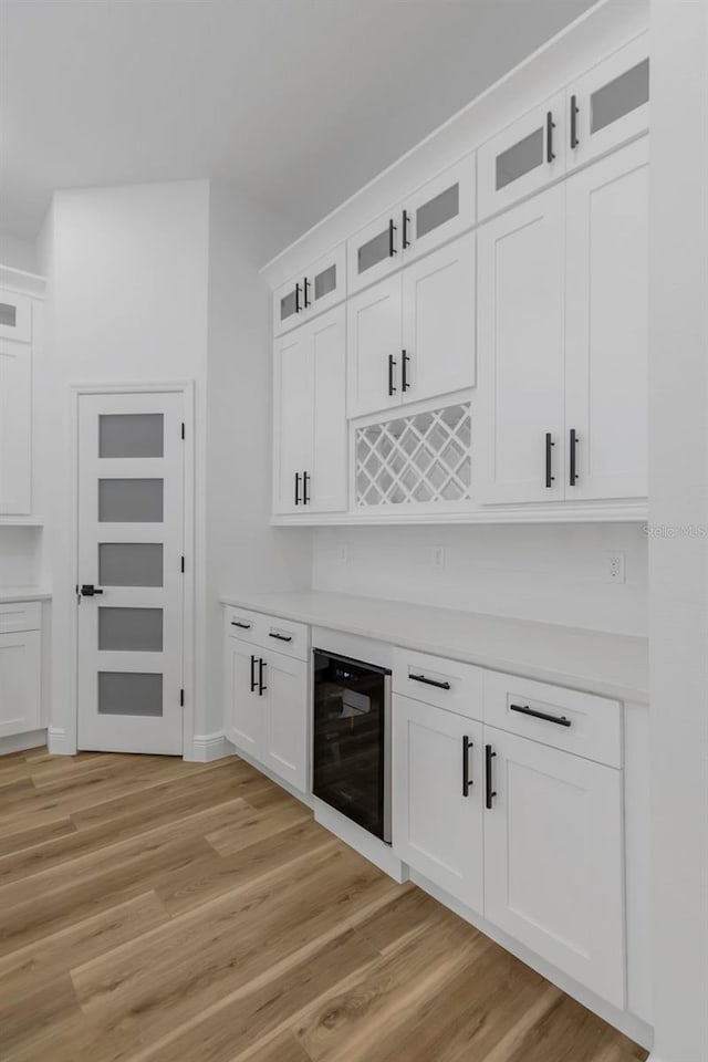 1213 E Lemon St, Tarpon Springs, FL 34689 - indoor dry bar with beverage cooler and light wood-style floors