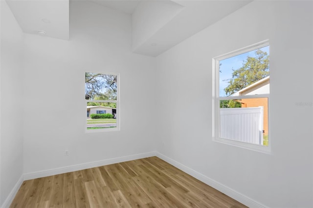1213 E Lemon St, Tarpon Springs, FL 34689 - spare room with baseboards and light wood finished floors