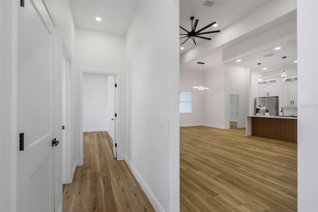 1213 E Lemon St, Tarpon Springs, FL 34689 - hall featuring light wood-style floors and recessed lighting