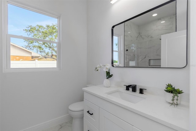 1213 E Lemon St, Tarpon Springs, FL 34689 - bathroom featuring marble look tiles, vanity, plenty of natural light, a marble finish shower, and recessed lighting