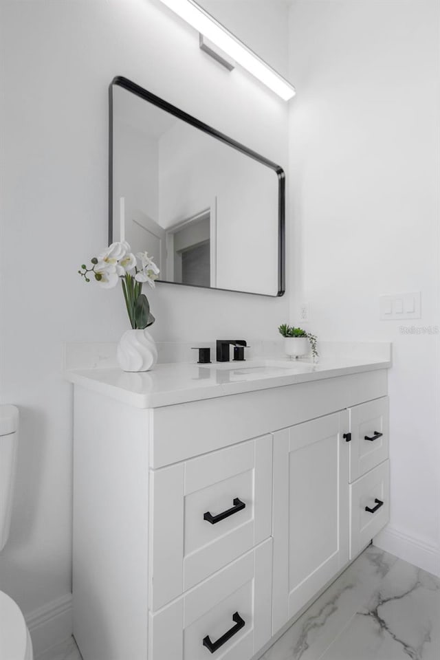 1213 E Lemon St, Tarpon Springs, FL 34689 - bathroom with vanity and marble finish floors