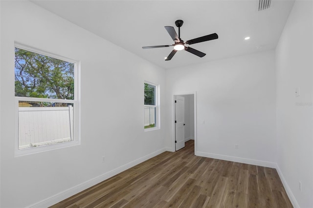 1213 E Lemon St, Tarpon Springs, FL 34689 - empty room featuring wood finished floors, ceiling fan, and recessed lighting