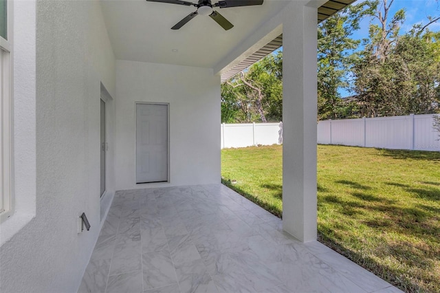 1213 E Lemon St, Tarpon Springs, FL 34689 - fenced backyard featuring ceiling fan and a patio area