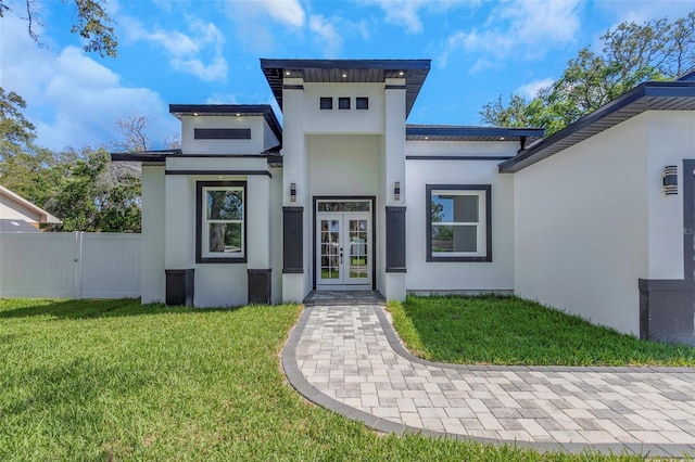 1213 E Lemon St, Tarpon Springs, FL 34689 - doorway to property featuring french doors and stucco siding