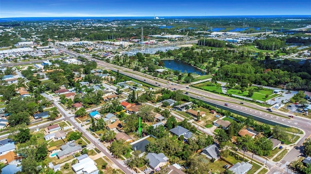 1213 E Lemon St, Tarpon Springs, FL 34689 - aerial view of property and surrounding area featuring a large body of water and nearby suburban area