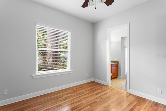 3307 W Knights Ave, Tampa, FL 33611 - empty room featuring a ceiling fan and light wood-style flooring
