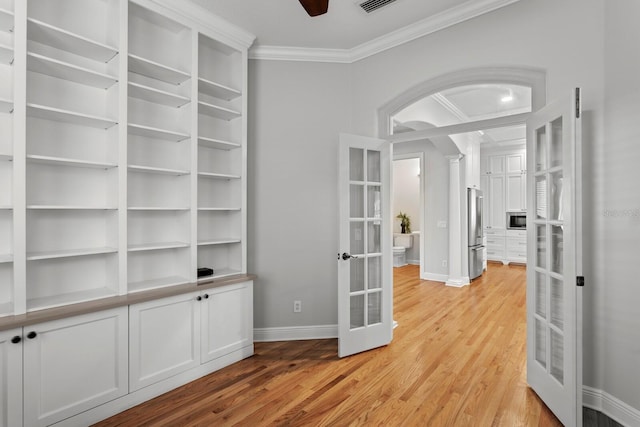 3307 W Knights Ave, Tampa, FL 33611 - corridor with french doors, ornamental molding, and light wood finished floors