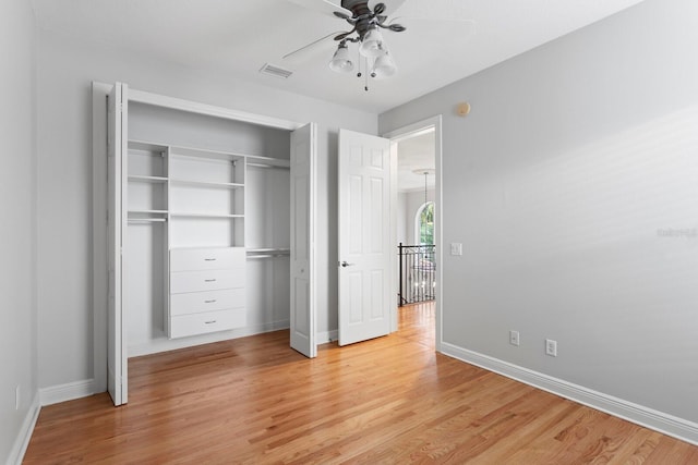 3307 W Knights Ave, Tampa, FL 33611 - unfurnished bedroom with light wood-style flooring, a closet, and a ceiling fan