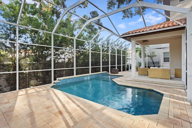 3307 W Knights Ave, Tampa, FL 33611 - swimming pool featuring a patio area, glass enclosure, and an outdoor hangout area