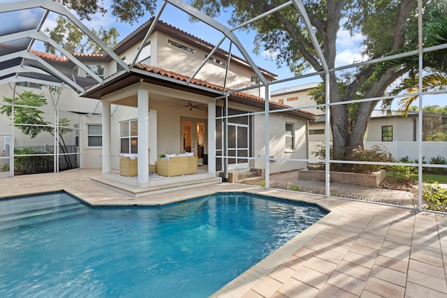 3307 W Knights Ave, Tampa, FL 33611 - back of property featuring stucco siding, a patio, a tiled roof, a ceiling fan, and french doors